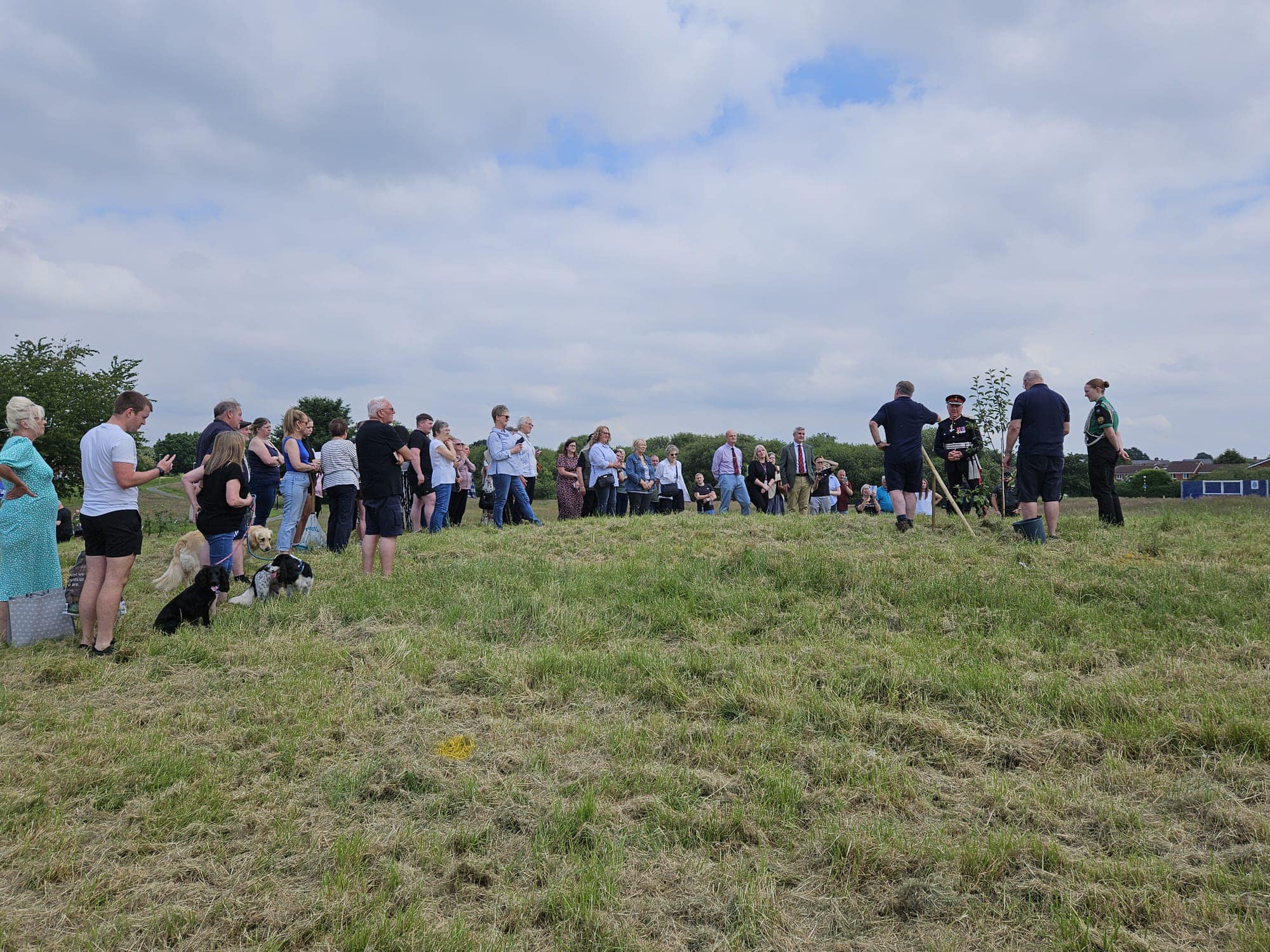 Local residents gather at Coppice Farm for the planting of the orchard